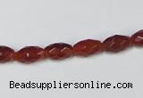 CAA124 15.5 inches 6*10mm faceted rice red agate gemstone beads