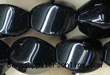 CAA2486 15.5 inches 10*14mm twisted rice black agate beads