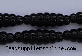 CAG1695 15.5 inches 10*30mm carved rice black agate beads