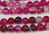 CAG2085 15.5 inches 6mm faceted round fuchsia line agate beads