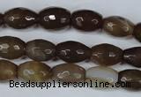 CAG3129 15.5 inches 10*14mm faceted rice brown line agate beads