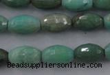 CAG3918 15.5 inches 6*10mm faceted rice green grass agate beads