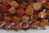 CAG582 15.5 inches 10*14mm faceted & twisted rice natural fire agate beads