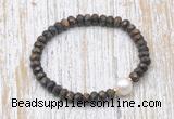 CFB754 faceted rondelle bronzite & potato white freshwater pearl stretchy bracelet