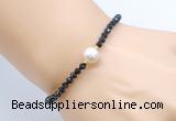 CFB833 4mm faceted round black onyx & potato white freshwater pearl bracelet