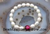 CFB916 9mm - 10mm rice white freshwater pearl & red tiger eye stretchy bracelet