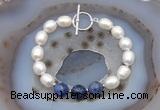 CFB930 Hand-knotted 9mm - 10mm rice white freshwater pearl & sodalite bracelet