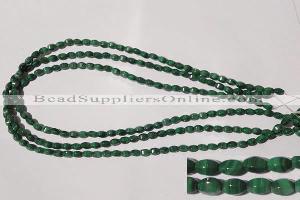 CMN222 15.5 inches 4*6mm faceted rice natural malachite beads