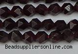 CNG7275 15.5 inches 6mm faceted nuggets red garnet beads