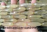 CRI132 15.5 inches 10*30mm faceted rice lemon quartz beads