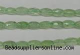 CRU165 15.5 inches 5*8mm faceted rice green rutilated quartz beads