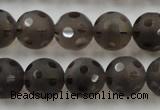 CSQ254 15.5 inches 14mm carved round matte smoky quartz beads