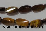 CTE1097 15.5 inches 8*15mm twisted & faceted oval yellow tiger eye beads