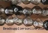 CTG2506 15.5 inches 4mm faceted round smoky quartz beads