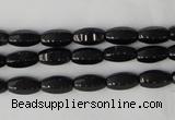 CTO116 15.5 inches 5*10mm faceted rice black tourmaline beads